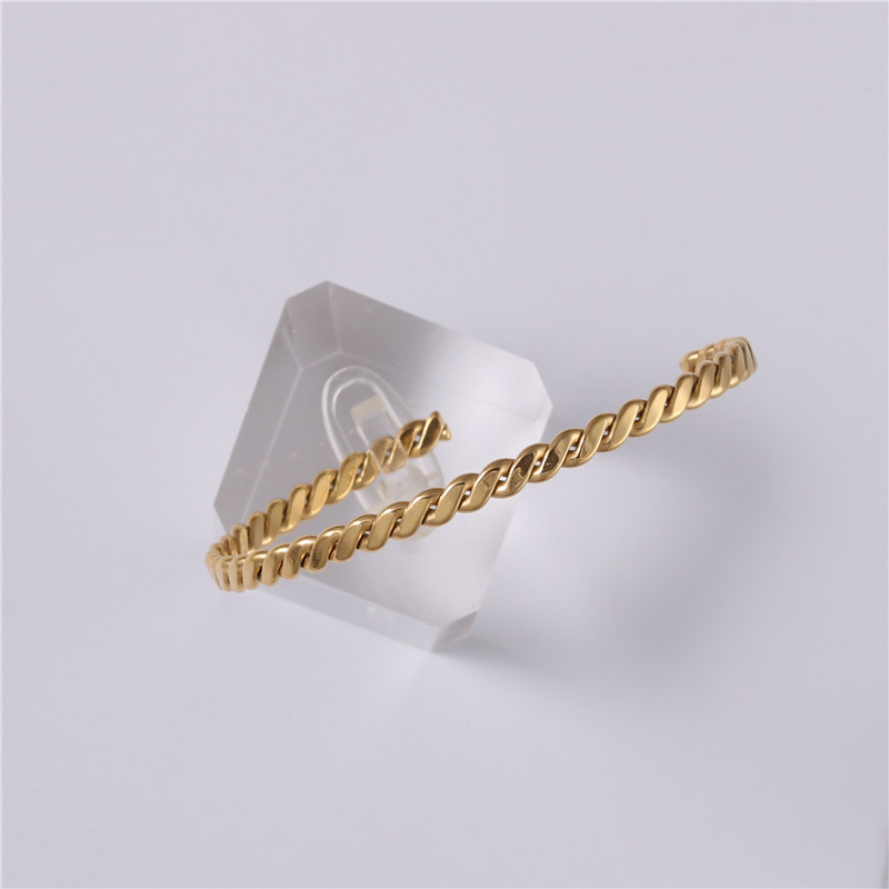 Embossed woven metal bracelet